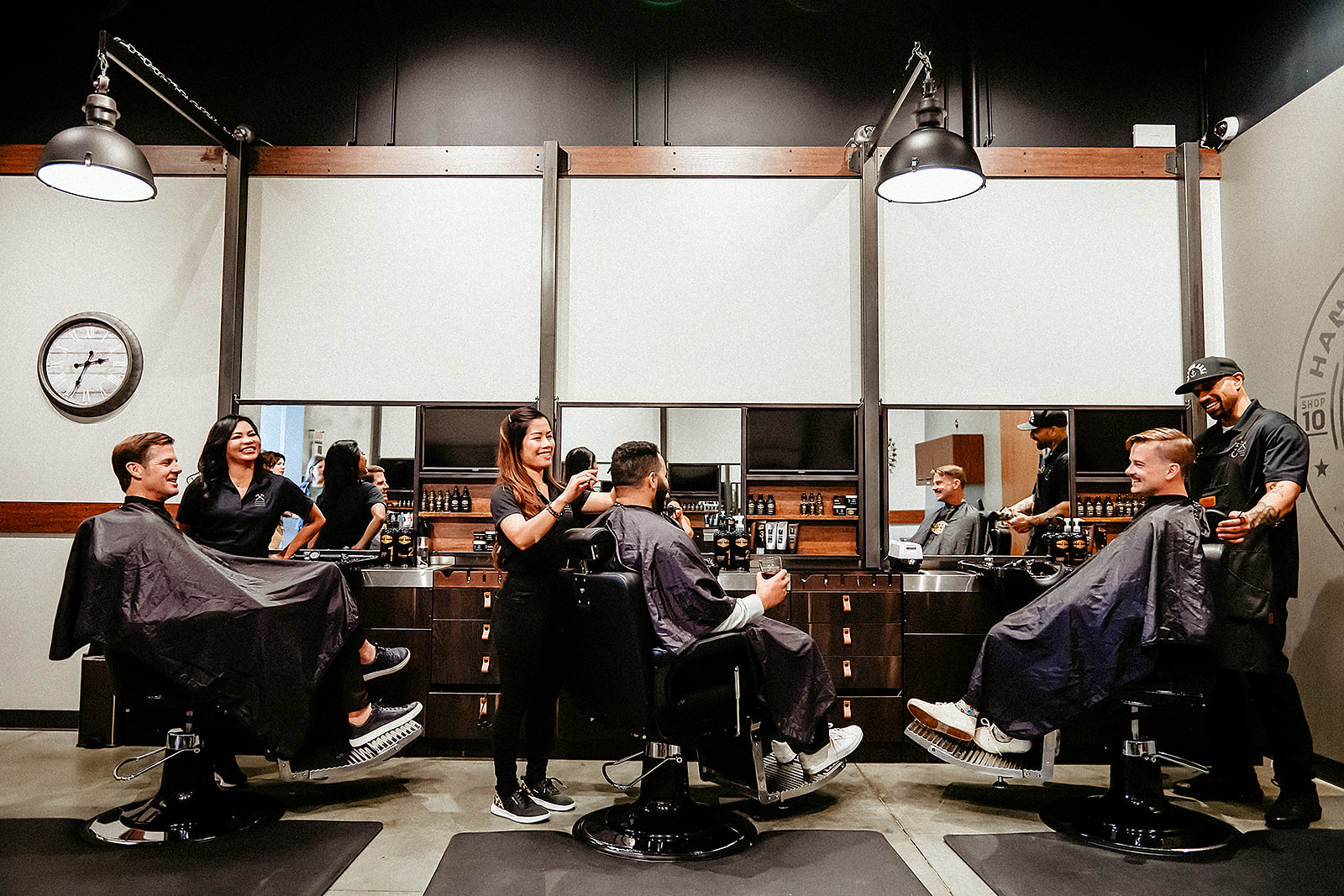 Luxury men's grooming lounge interior with warm amber lighting